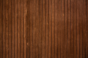 Vintage brown wood background texture with knots and nail holes.Vintage wooden dark horizontal boards.