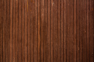 Vintage brown wood background texture with knots and nail holes.Vintage wooden dark horizontal boards.