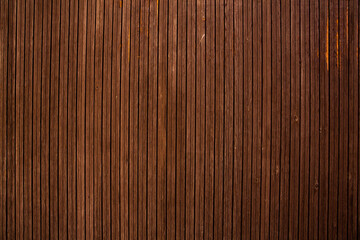 Vintage brown wood background texture with knots and nail holes.Vintage wooden dark horizontal boards.