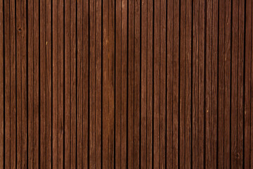 Vintage brown wood background texture with knots and nail holes.Vintage wooden dark horizontal boards.