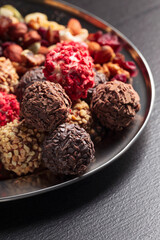 Homemade chocolate candy with nuts and dried fruits.