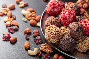 Homemade chocolate candy with nuts and dried fruits.