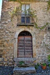 Fototapeta na wymiar The door of an old house of Villa Santo Stefano, a medieval town of Lazio region, Italy.