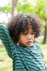 Portrait of African American boy playing in the park with happy and smile