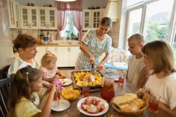 big family at the dinner table .