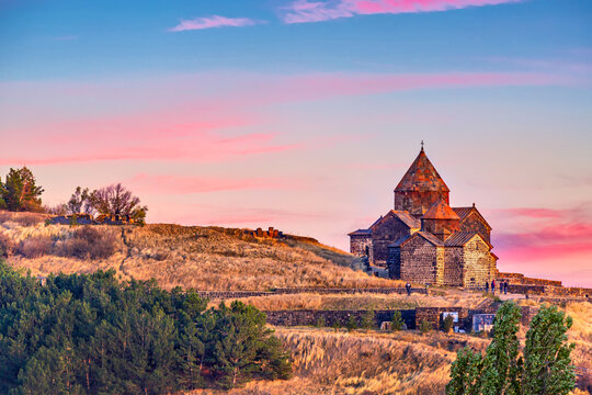 Ancient Sevanavank monastery on Lake Sevan in Armenia during sunset