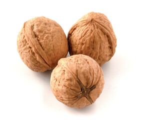 Three walnuts isolated on white background.