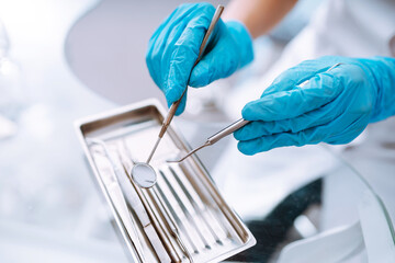 A set of sterile dental instruments for dental treatment. Dental care for people.