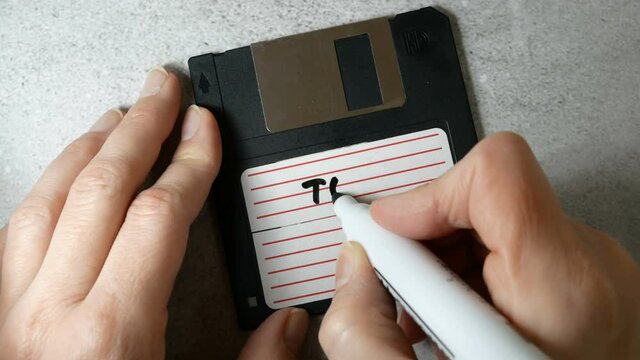 Top secret information on retro vintage floppy disk magnetic computer, concept, closeup
