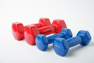 Simple Dumbbell. Sport equipment. Blue and red dumbbells for fitness on a white background.