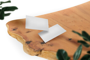 Clean minimal business card mockup on wood table with leaves