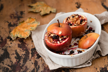 Red baked apples with oatmeal , walnuts and honey. Autumn winter dessert