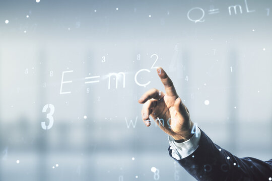 Man hand working with scientific formula hologram on blurred classroom background, research concept. Multiexposure