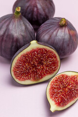 Two halves of fig and Whole purple figs