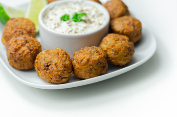 Falafels, gently spiced blend of sweet potato, chickpeas and onion with a sour dip