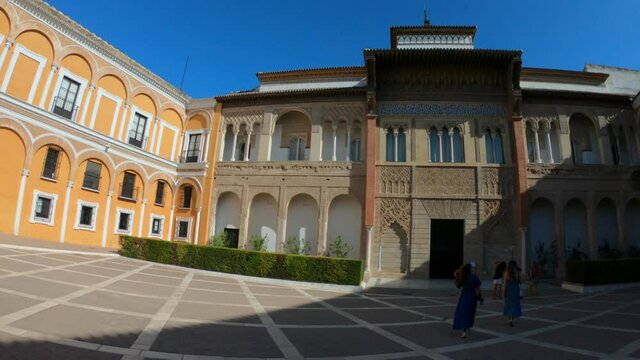 Sevilla, Spain, September 11, 2021: PAN SHOT - The Royal Palace of Seville (Real Alcazar). Mudejar Palace of Pedro I in the Hunting Courtyard (Patio de la Monteria).