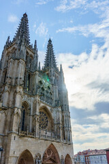 Burgos, Spain - August 25, 2021. Burgos Cathedral and Sana Maria square statue