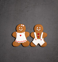 Christmas Gingerbread man and woman Cookies on a grey background