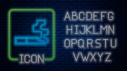 Fototapeta premium Glowing neon Cigarette icon isolated on brick wall background. Tobacco sign. Smoking symbol. Neon light alphabet. Vector