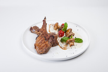 rack of lamb, mushrooms, white sauce, tomatoes