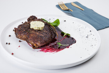 steak, red sauce, white plate