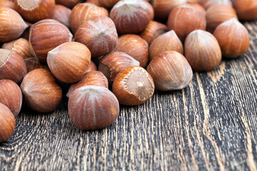 whole hazelnuts on a wooden table,in shell