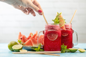 Watermelon mojito fresh red drink. With watermelon, lemon, lime, mint leaves and ice