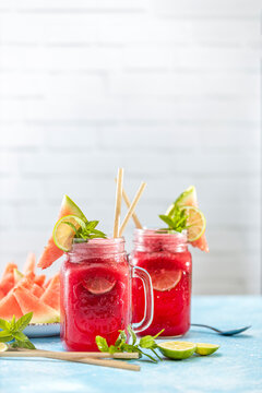 Watermelon mojito fresh red drink. With watermelon, lemon, lime, mint leaves and ice