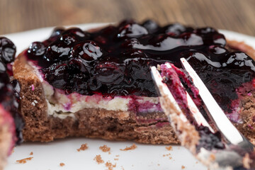 cake with butter cream and black currant jam