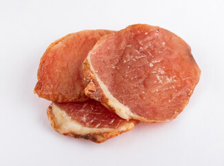 Dried meat slices. Pork pieces, on a white plate. Close-up