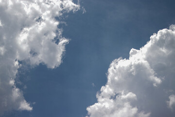 Cumulus clouds with a clear blue sky background in the midday. Types of clouds stock images.