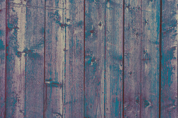 Empty dark wooden backdrop with vertical boards with copy space. Backdrop made of wood textures surface, top view. Scratches and scrapes on old paint
