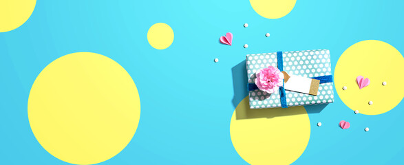 Appreciation theme with a gift box and a pink carnation flower