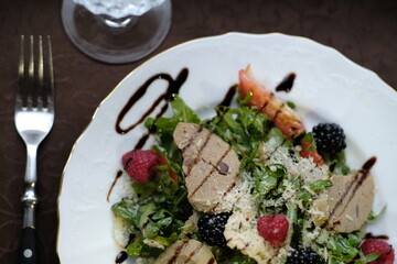 salad of herbs, berries and meat pate