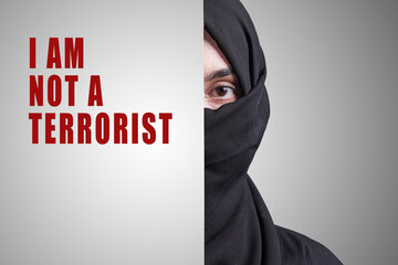 I am not a terrorist. Muslim girl in traditional nikab clothing