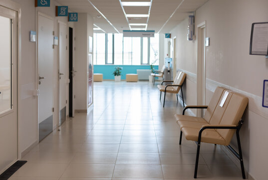 Empty Corridor Of Hospitals, Clinics, Office Rent. Sofas For Seating And Waiting Area. Nobody