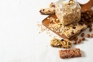 Nuts and oats energy mix bars on white background