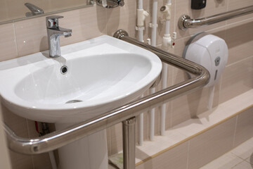 Toilet, shower and bathroom equipped with handrails for people with disabilities. Comfort and care...