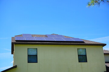 Solar panel on a house roof; Green energy from sun