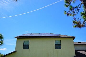 Solar panel on a house roof; Green energy from sun
