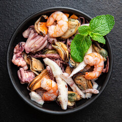 seafood fresh mix shrimp, squid, mussel, rapan, octopus portion ready to eat meal snack on the table copy space food background 