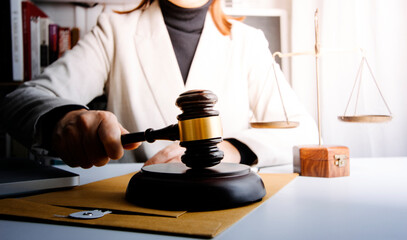 Business and lawyers discussing contract papers with brass scale on desk in office. Law, legal services, advice, justice and law concept picture with film grain effect