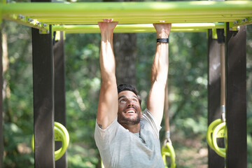 exercise fitness athlete exercising on monkey bars