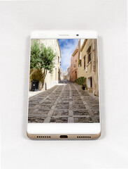 Modern smartphone displaying picture of ancient street in Erice, Italy