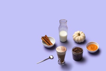 Pumpkin spiced latte with ingredient on violet background with copy space for text. Halloween and Thanksgiving Day composition.