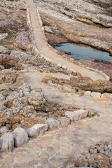 Cap d'Antibes hiking trail. Stone path at the seaside. 