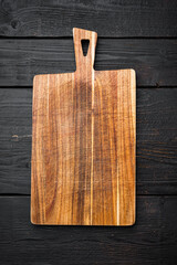 Bamboo cutting board empty for empty for copy space for text or food, top view flat lay , on black wooden table background