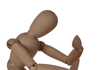 A wooden figure of a man holding his head, sitting in a thoughtful pose, heavy thoughts, anxiety, the problem of choice, alco