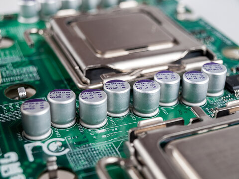 Solid-state capacitors on the motherboard of a desktop personal computer, server computer, electric batteries, computer repair, selective focus