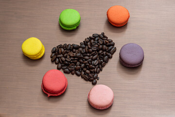 Valentain days still life with macaroons and coffee beans heart